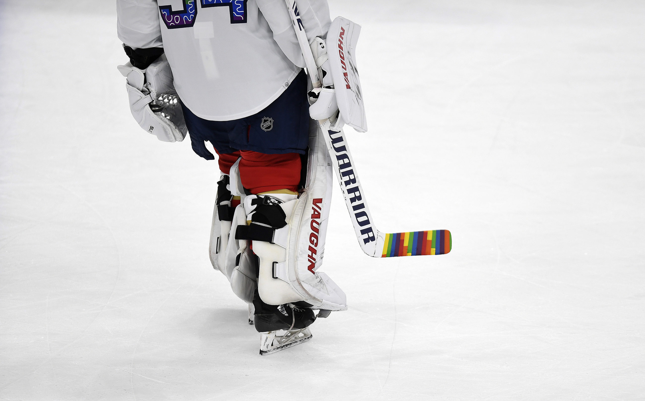 Florida Panthers goaltender Alex Lyon warms up with a colorful hockey stick during "pride" night before playing the Toronto Maple Leafs in Sunrise, Florida, on March 23. Last week the NHL sent memos to teams informing them of protocols for themed celebrations for the upcoming season, including the banning of "pride" tape during "pride" nights.