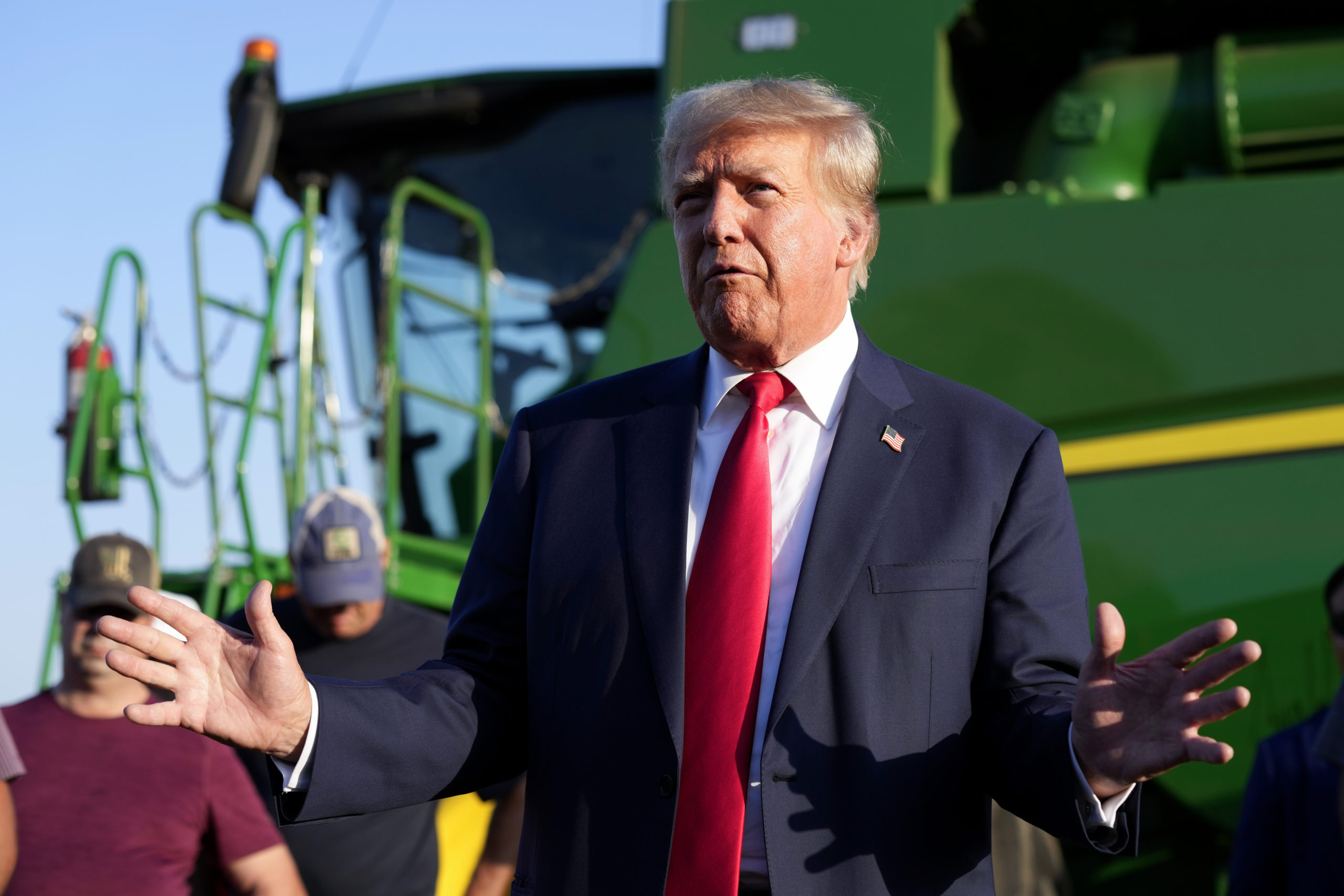 Former President Donald Trump speaks to reporters on Sunday during a visit to the Vande Voort family farm in Leighton, Iowa.