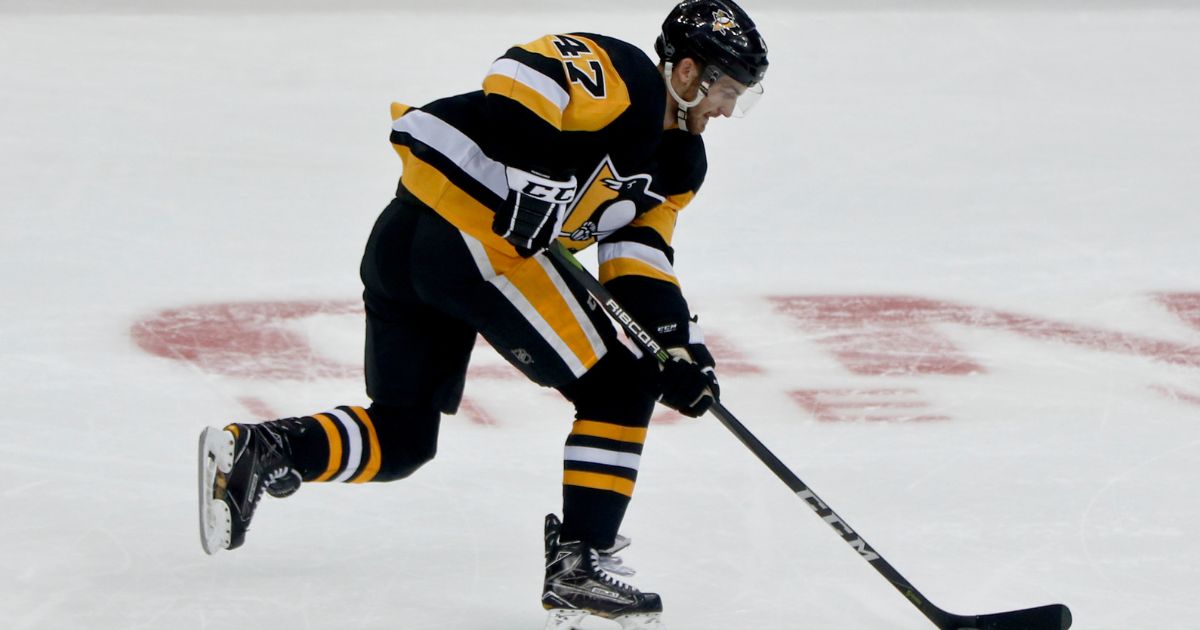 Then-Pittsburgh Penguins player Adam Johnson plays against the Columbus Blue Jackets during an NHL preseason hockey game in Pittsburgh, Pennsylvania, on Sept. 22, 2018.