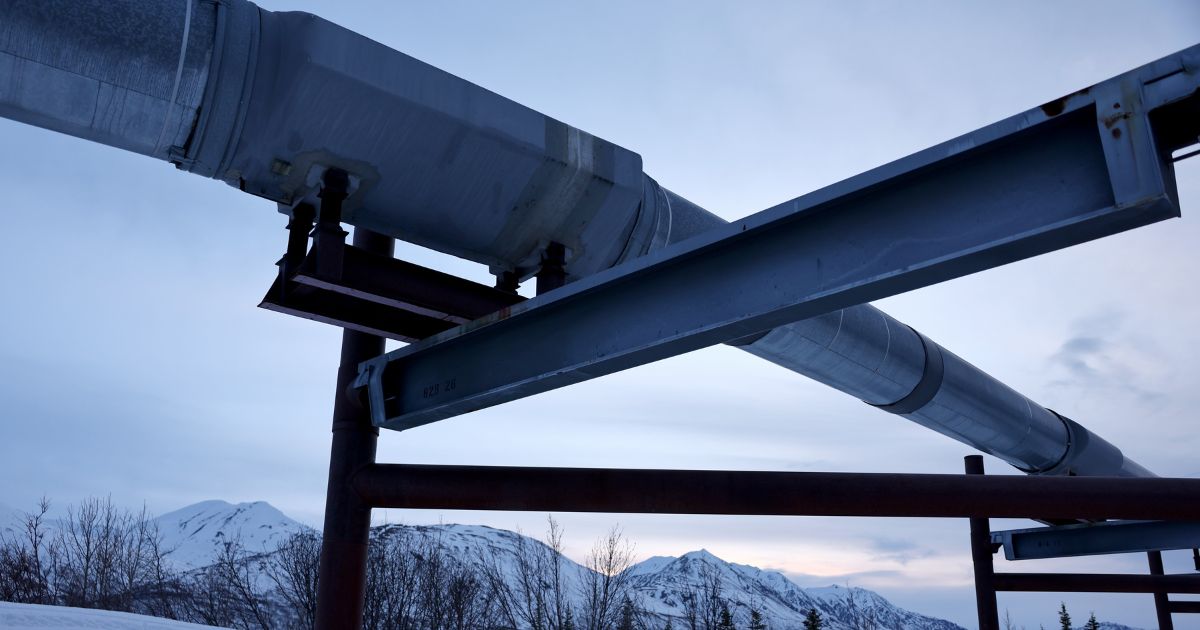 A part of the Trans Alaska Pipeline system located in the Alaska Range mountains is pictured on May 5. Alaska is suing the Biden administration over the loss of gas and oil leases that were available during the previous administration.