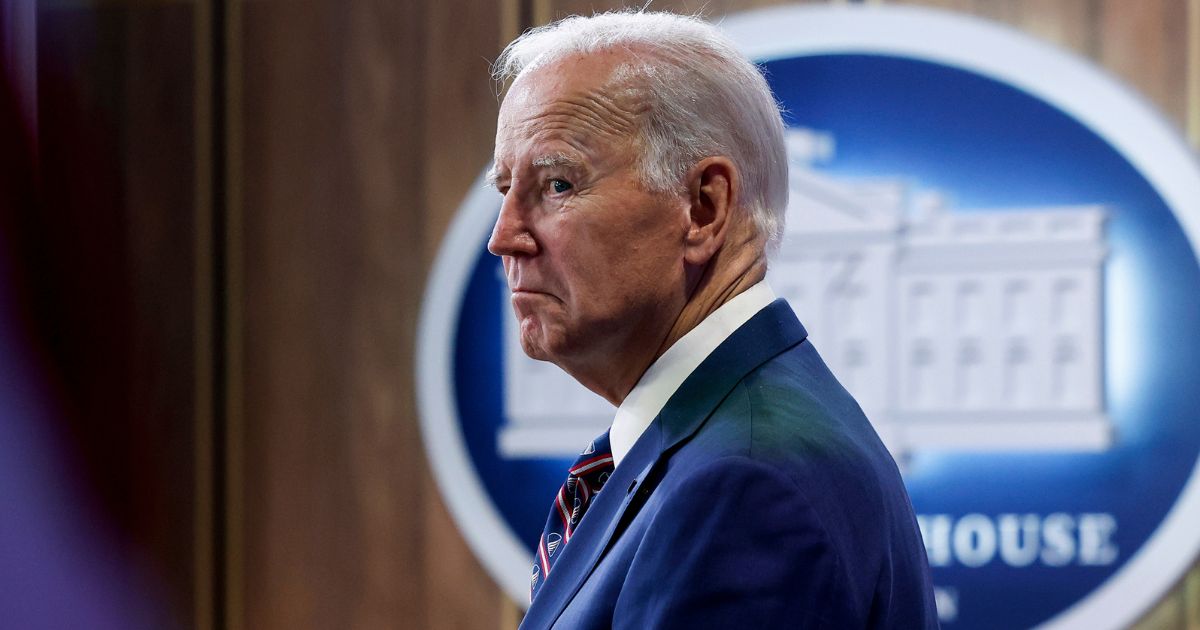 President Joe Biden listens as he is introduced at an event in the South Court Auditorium of the Eisenhower Executive Office Building at the White House in Washington on Monday.