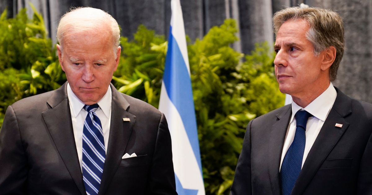 President Joe Biden and U.S. Secretary of State Antony Blinken stand together Wednesday in Tel Aviv, Israel, while meeting with victims' relatives and first responders who were directly affected by the Oct. 7 Hamas attacks.