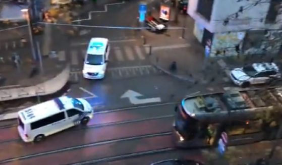 Police vehicles converge during an overnight hunt for a gunman who killed two in a terror attack in Brussels, Belgium.