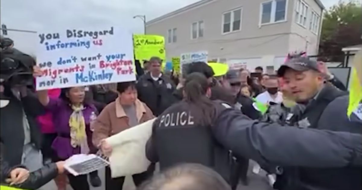 Residents protest against a planned illegal migrant shelter in Chicago on Oct. 19.