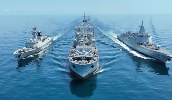 Warships attached to a combat support ship flotilla of the Chinese navy steam in formation during a comprehensive replenishment training exercise on Sept. 22.
