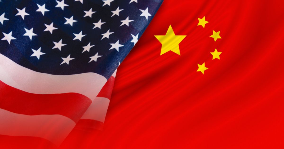 The American and Chinese flags are seen in this stock image.