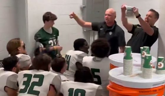 Eric Coovert, an assistant football coach at Kingwood Park High School in Kingwood, Texas, tells his team that he has won his cancer fight.