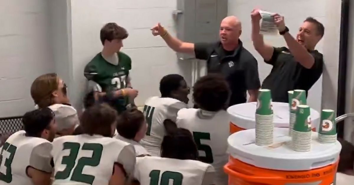 Eric Coovert, an assistant football coach at Kingwood Park High School in Kingwood, Texas, tells his team that he has won his cancer fight.