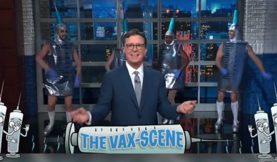 Late-night host Stephen Colbert dances in a "Vax-Scene" segment.
