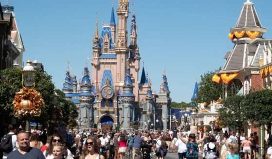 Visitors walk along Main Street at the Magic Kingdom in Walt Disney World in Orlando, Florida, on Sept. 30, 2022.