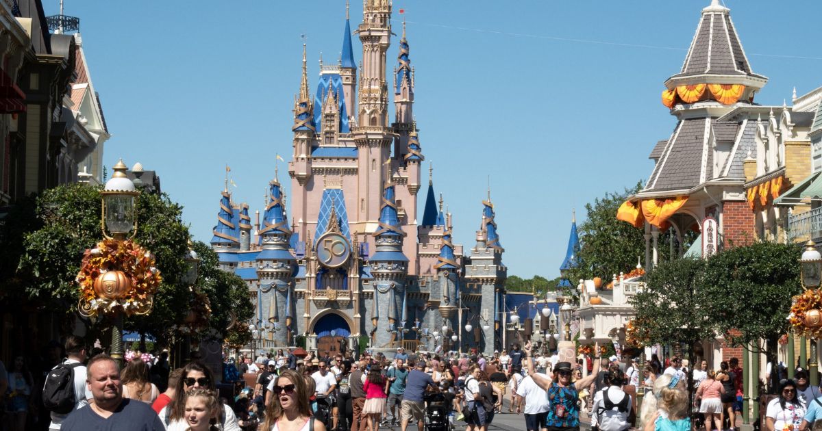Visitors walk along Main Street at the Magic Kingdom in Walt Disney World in Orlando, Florida, on Sept. 30, 2022.