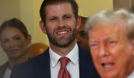 Eric Trump stands behind his father, former President Donald Trump, as the elder Trump speaks to the media on the third day of his civil fraud trial at New York State Supreme Court in New York City on Wednesday.