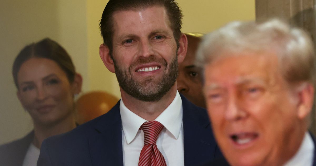 Eric Trump stands behind his father, former President Donald Trump, as the elder Trump speaks to the media on the third day of his civil fraud trial at New York State Supreme Court in New York City on Wednesday.