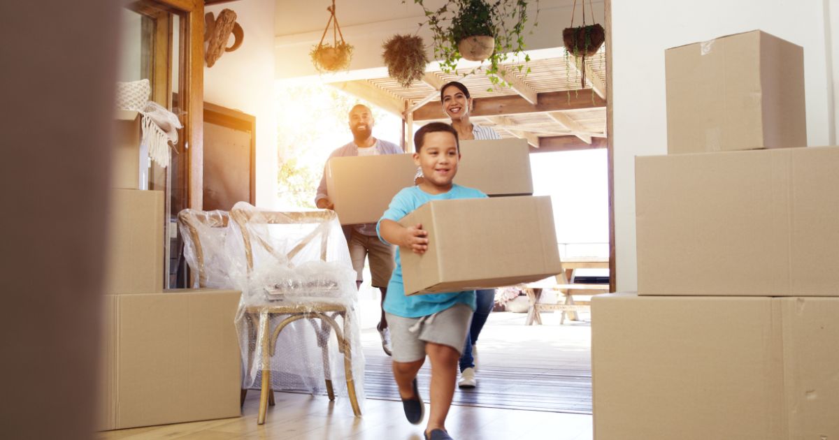 This stock image shows a family happily moving into a new home. A new study shows that under Biden's economy the average American cannot afford a home in 99 percent of the counties across the country.