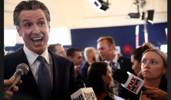 California Gov. Gavin Newsom talks to reporters in the spin room following the FOX Business Republican Primary Debate on Sept. 27 in Simi Valley, California. Newsom recently vetoed several far-left pieces of legislation, leading some to speculate he may be planning to run for president.