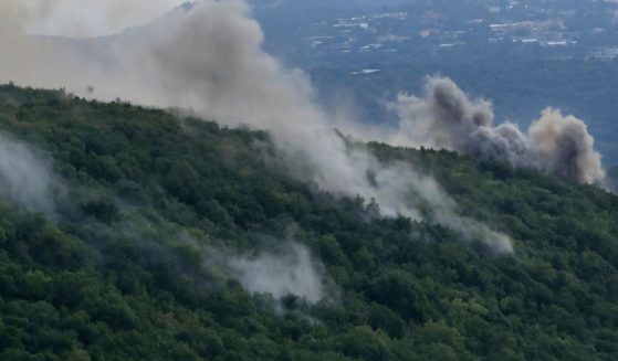 Smoke can be seen in the Aita al-Shaab village of south Lebanon after Israeli troops shelled the town. Also on Monday, Israeli Defense Forces shot and killed several gunmen who had entered Israel from Lebanon.