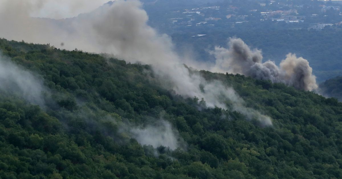 Smoke can be seen in the Aita al-Shaab village of south Lebanon after Israeli troops shelled the town. Also on Monday, Israeli Defense Forces shot and killed several gunmen who had entered Israel from Lebanon.