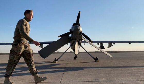 A U.S. serviceman walks past a drone at the al-Asad air base in the western Iraqi province of Anbar on Jan. 13, 2020.