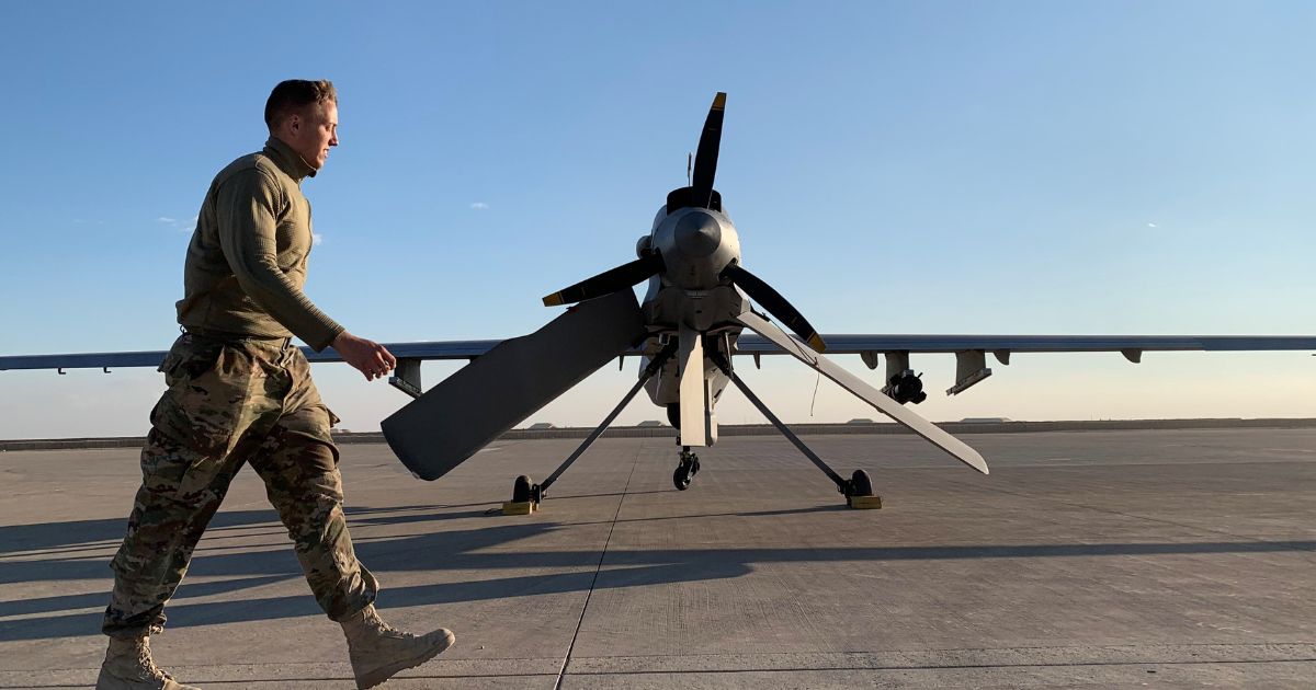 A U.S. serviceman walks past a drone at the al-Asad air base in the western Iraqi province of Anbar on Jan. 13, 2020.