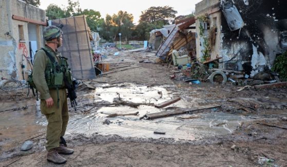 An Israeli soldier surveys the scene of of a Palestinian militant attack in the Israeli kibbutz of Kfar Aza on the border with the Gaza Strip on Wednesday. A group of Americans from Sunnyside Baptist Church were in Israel when the conflict started over the weekend but were able to return safely home on Wednesday.