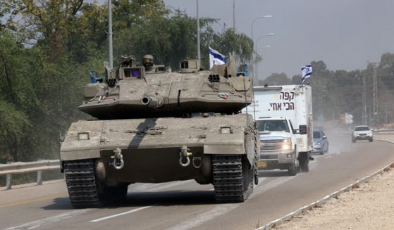 An Israeli tank drives Sunday on a road near Sderot, an Israeli city that was targeted in Saturday's surprise attack by the Hamas terrorist group. The Israeli cabinet on Sunday declared war on Hamas.