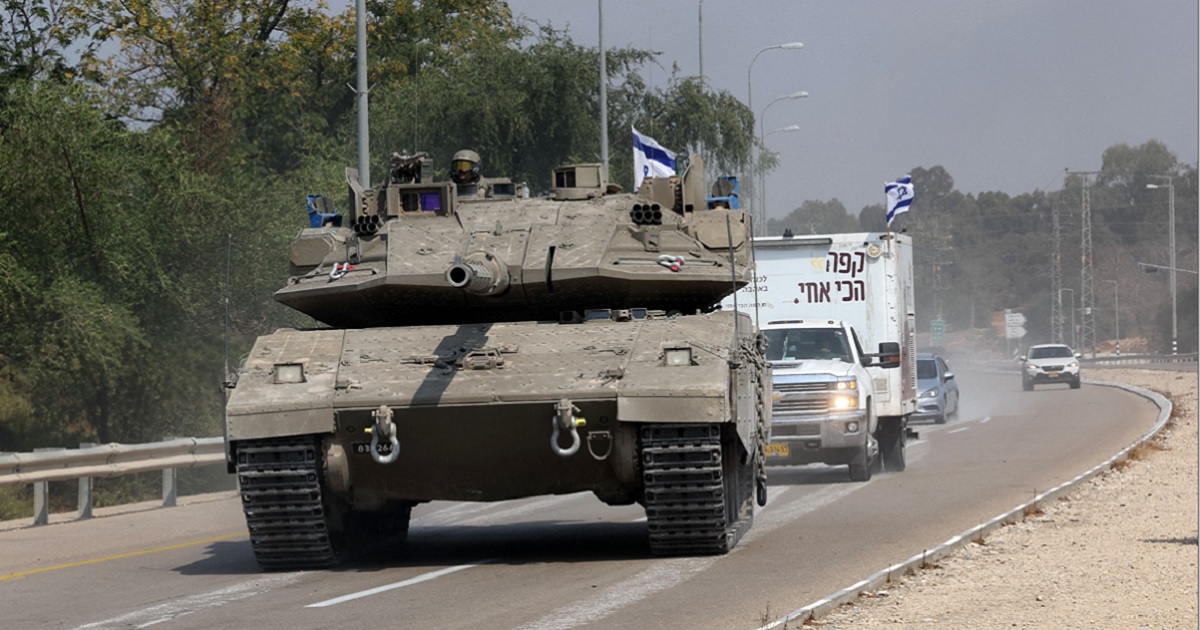 An Israeli tank drives Sunday on a road near Sderot, an Israeli city that was targeted in Saturday's surprise attack by the Hamas terrorist group. The Israeli cabinet on Sunday declared war on Hamas.