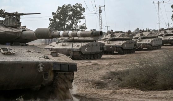 Israeli Merkava tanks deploy along the border with the Gaza Strip in southern Israel on Friday.