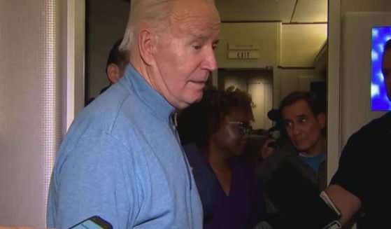 President Joe Biden speaks with reporters on Air Force One on Wednesday.