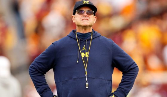 Head coach Jim Harbaugh of the Michigan Wolverines looks on prior to the start of the game against the Minnesota Golden Gophers in Minneapolis, Minnesota, on Oct. 7.