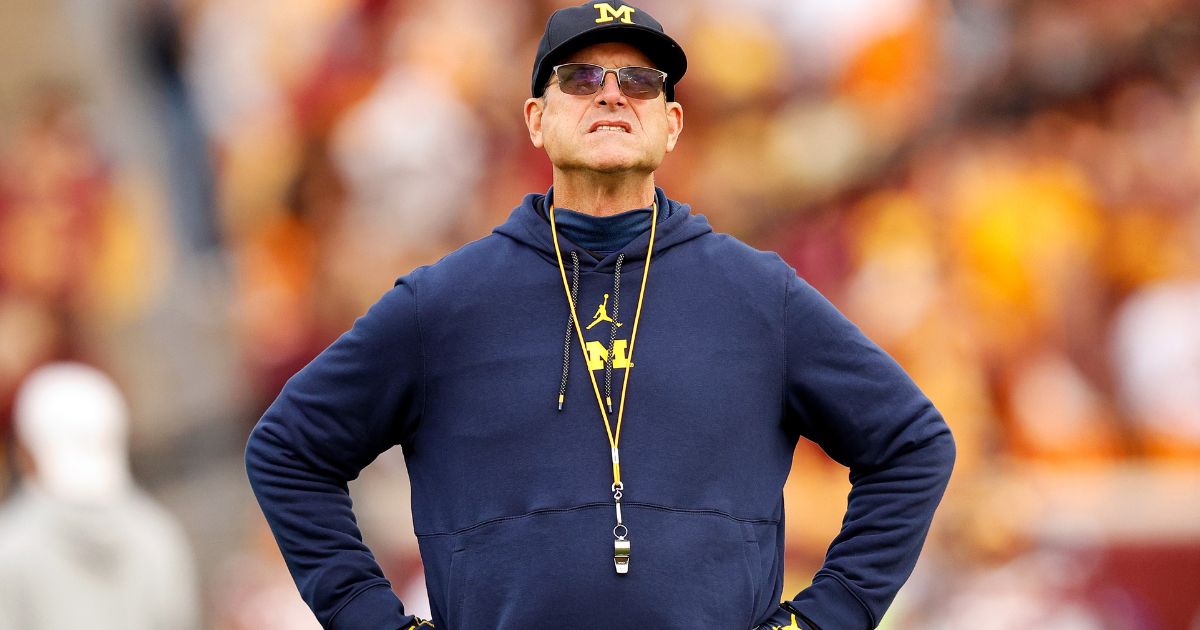 Head coach Jim Harbaugh of the Michigan Wolverines looks on prior to the start of the game against the Minnesota Golden Gophers in Minneapolis, Minnesota, on Oct. 7.