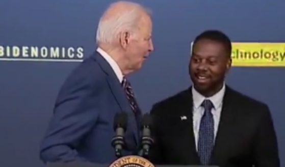 On Monday, Mark Anthony Thomas, right, was supposed to introduce President Joe Biden, left, before his speech, but Biden came out and started speaking before realizing his mistake.