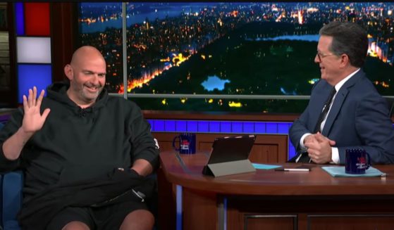 On Wednesday, Sen. John Fetterman, left, appeared on "The Late Show with Stephen Colbert," where he told host Stephen Colbert, right, that Americans do "not send their best and brightest to D.C." when he referenced his Republican colleagues.