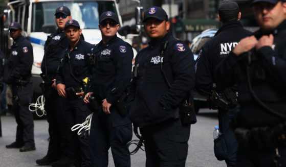 Police officers stand guard on Monday in New York City.