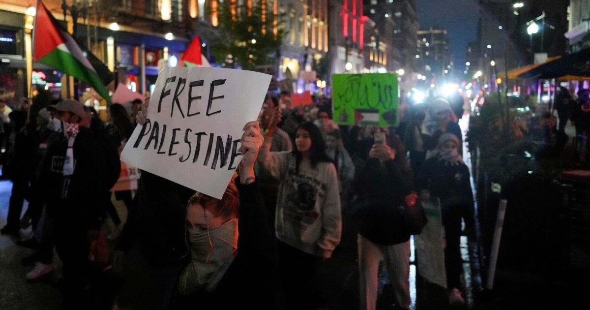 Demonstrators march in a pro-Palestinian rally in Cincinnati on Saturday.