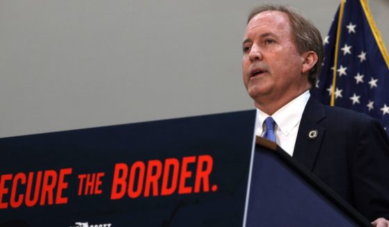 Texas Attorney General Ken Paxton, seen in a 2021 photo, is suing the federal government for directing Border Patrol employees to cut razor wire to allow illegal immigrants through.