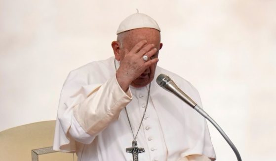 Pope Francis making the sign of the cross