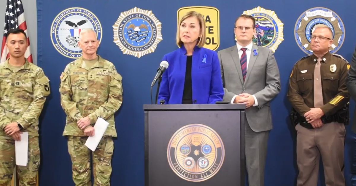 Republican Iowa Gov. Kim Reynolds holds a news conference Wednesday with Iowa National Guard and state Department of Public Safety officials.