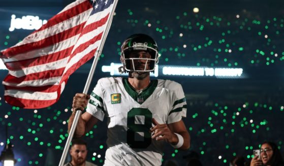Aaron Rodgers of the New York Jets takes the field prior to a game against the Buffalo Bills at MetLife Stadium in East Rutherford, New Jersey, on Sept. 11.