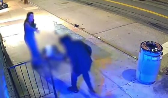 The assailant came back to spit on the stabbing victim's horrified girlfriend before kicking the fallen man.