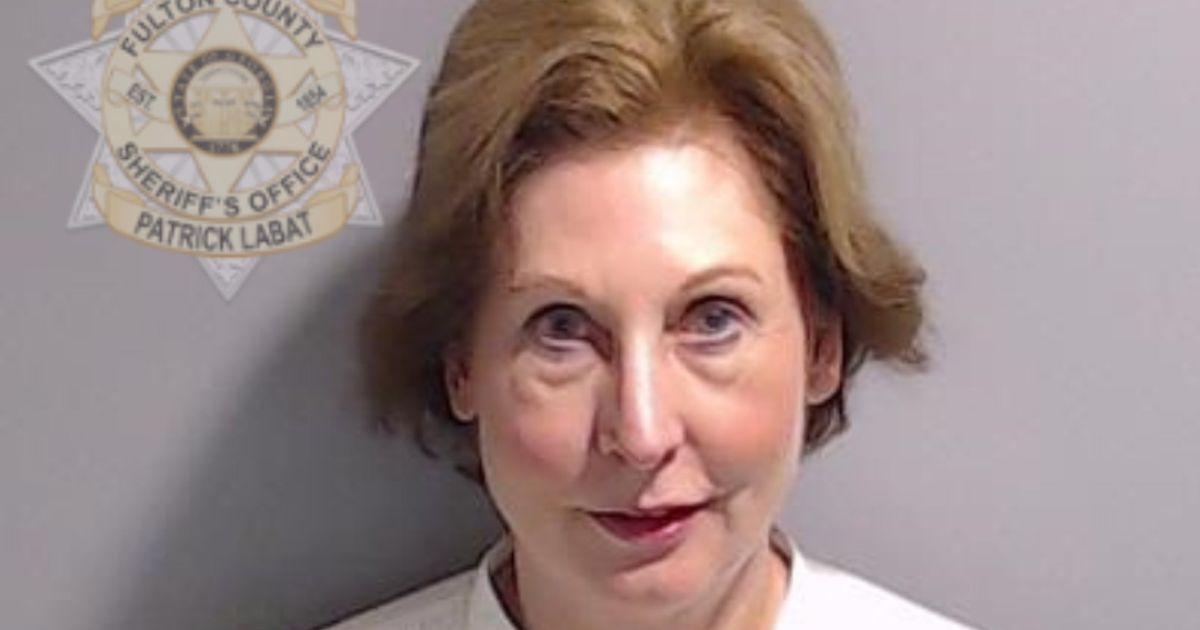 Attorney Sidney Powell poses for her booking photo with the Fulton County Sheriff's Office in Atlanta, Georgia, on Aug. 23. On Thursday, Powell took a plea deal in the Georgia election interference case wherein she agreed to testify against other defendants.