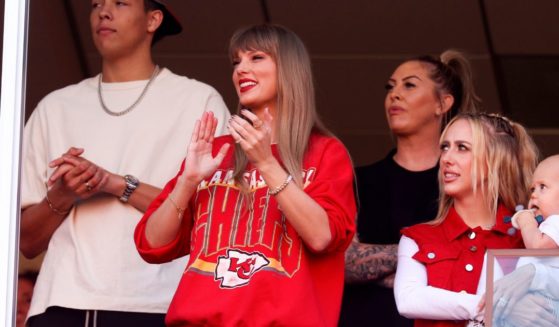 Taylor Swift, center, reacts during a game between the Los Angeles Chargers and Kansas City Chiefs at Arrowhead Stadium on Sunday in Kansas City, Missouri.