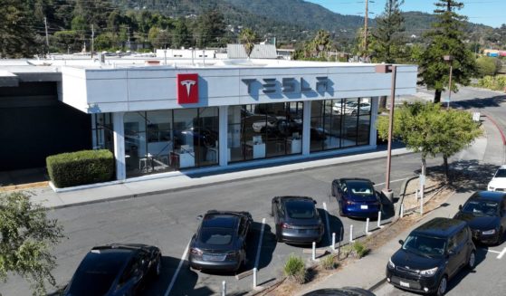 New Tesla cars sit parked at a Tesla dealership in Corte Madera, California, on Wednesday.