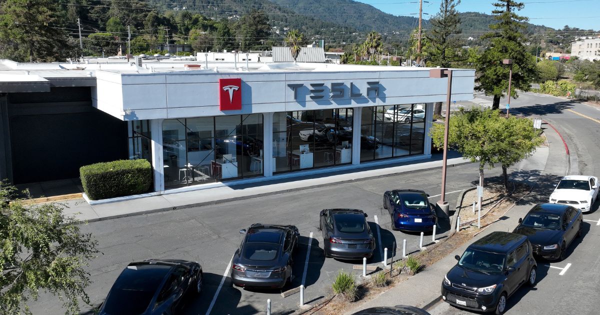 New Tesla cars sit parked at a Tesla dealership in Corte Madera, California, on Wednesday.