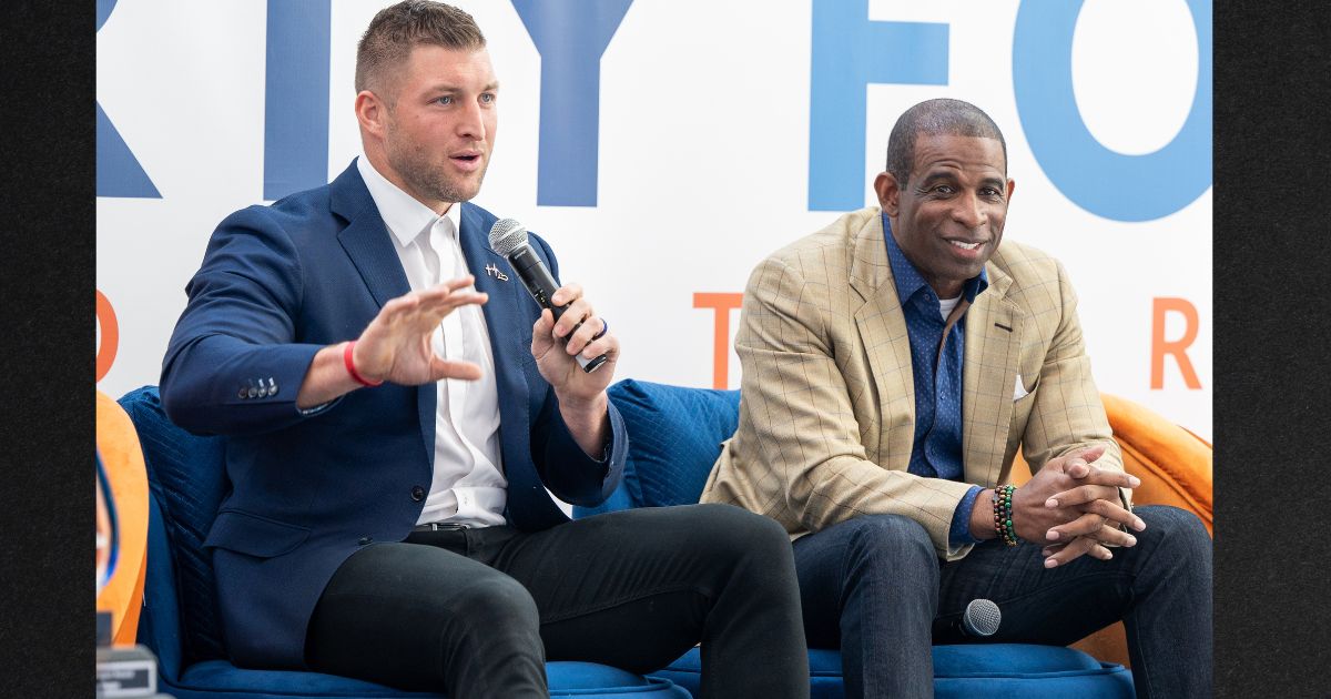 Tim Tebow and Deion Sanders, seen in a photo from the 2022 International Poverty Forum, have been friends for a long time.
