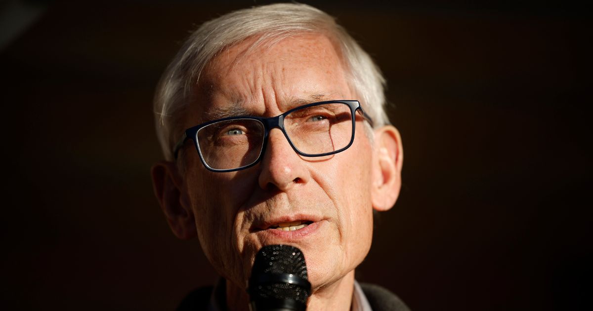 Gov. Tony Evers of Wisconsin delivers remarks during a canvassing launch event with volunteers and supporters in Madison, Wisconsin, on Nov. 6, 2022. On Wednesday, a man visited the Wisconsin state Capitol twice with guns, demanding to speak to the governor.