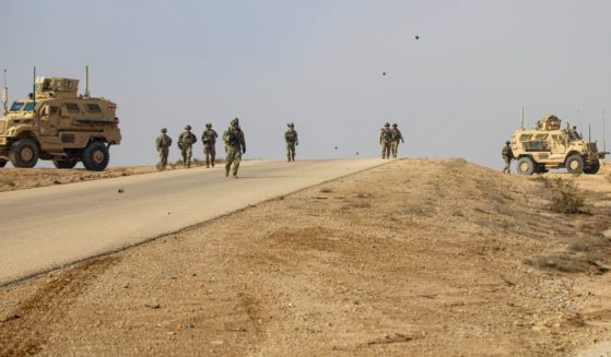 U.S. soldiers conduct a dismounted patrol at al-Asad Air Base in Iraq on Nov. 18, 2022.