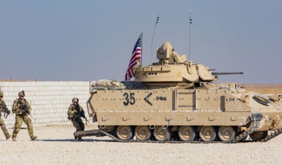 Soldiers assigned to the National Guard demonstrate capabilities with an M2A2 Bradley Fighting Vehicle for reporters in eastern Syria on Nov. 11, 2019.