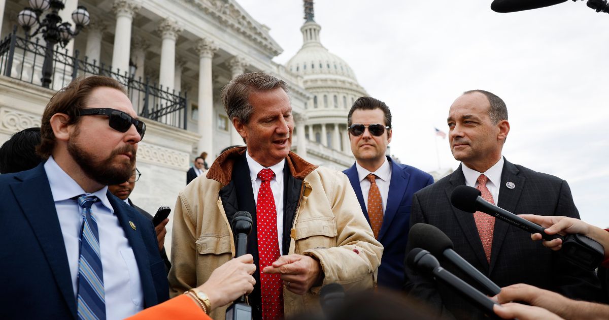 Reps. Eli Crane, left, Tim Burchett, left middle, Matt Gaetz, right middle, and Bob Good, right, talk to reporters after the House of Representatives failed to elect Rep. Jim Jordan to speaker of the House at the U.S. Capitol in Washington, D.C., on Friday.