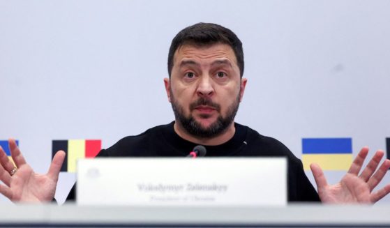 Ukraine President Volodymyr Zelenskyy gestures during a news conference in Brussels on Oct. 11.