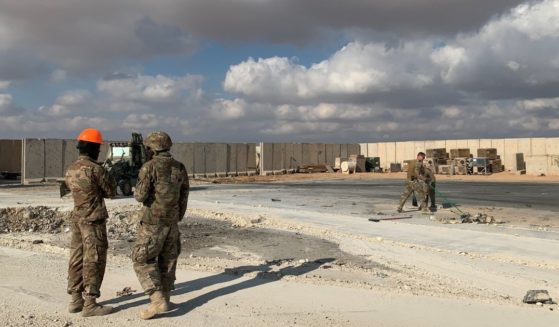 A picture taken on Jan. 13, 2020, during a press tour organized by the US-led coalition fighting the remnants of the Islamic State group, shows U.S. soldiers clearing rubble at Ain al-Asad military airbase in the western Iraqi province of Anbar.